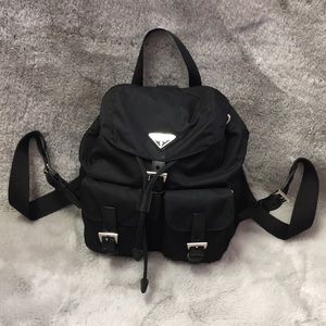 PRADA. BLACK MINI BACKPACK. ADJUSTABLE STRAPS.